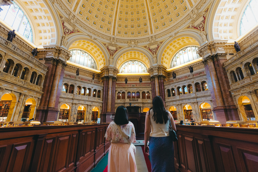 Two people inside the Library of Congress