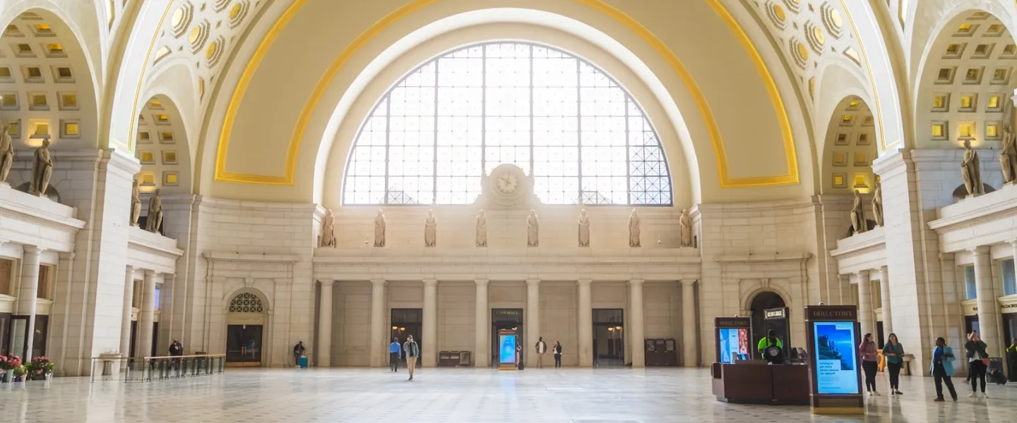 The grand interior of Union Station features a soaring coffered ceiling and spacious marble hall filled with natural light.