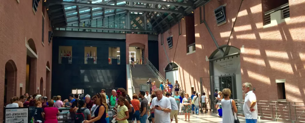 Visitors stand in the atrium of the United States Holocaust Memorial Museum in DC. 